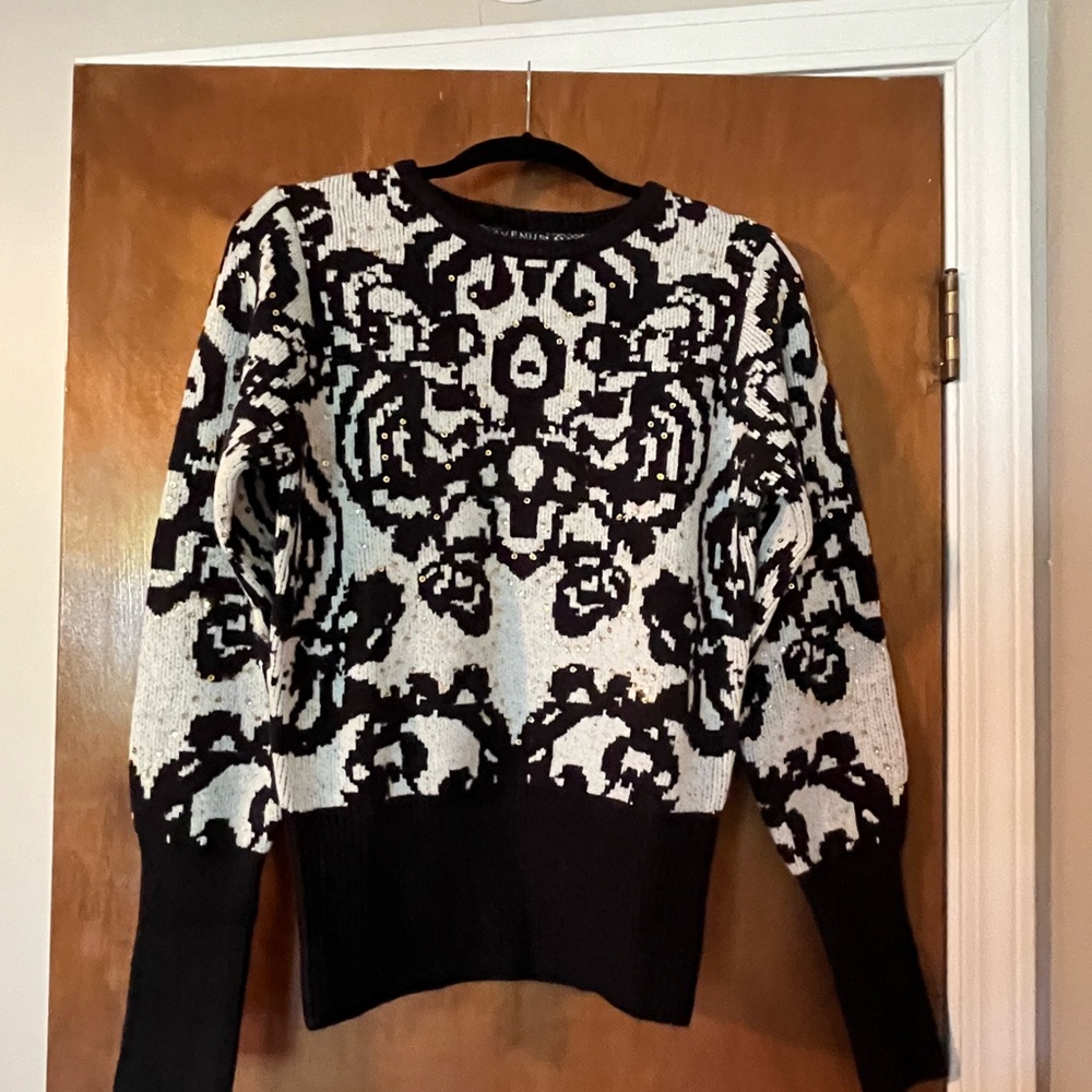 Woman’s sweater. Grayish with black and gold sparkly dots.